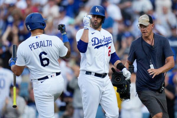 Los Angeles Dodgers designated hitter J.D. Martinez (28) celebrates with David Peralta (6) after hitting a home run during the seventh inning of a baseball game against the New York Yankees in Los Angeles on June 4, 2023. (Ashley Landis/AP Photo)