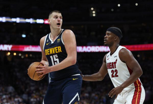 Jimmy Butler (22) of the Miami Heat defends against Nikola Jokic (15) of the Denver Nuggets during the third quarter in Game Two of the 2023 NBA Finals at Ball Arena in Denver on June 4, 2023. (Matthew Stockman/Getty Images)