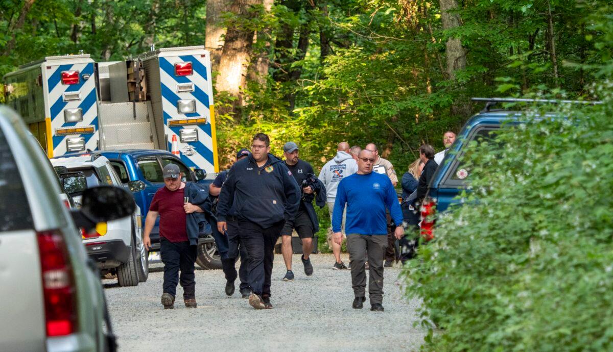 Search and rescue teams leave the command post at St. Mary's Wilderness en route to the Blue Ridge Parkway to search for the site where a Cessna Citation crashed over mountainous terrain near Montebello, Va., on June 4, 2023. (Randall K. Wolf via AP)