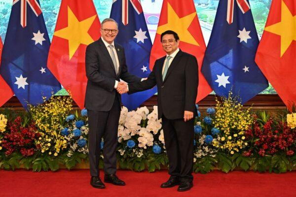 Vietnam's Prime Minister Pham Minh Chinh (R) and Australia's Prime Minister Anthony Albanese (L) shake hands during a meeting at the Government Office in Hanoi on June 4, 2023. (Nhac Nguyen/AFP via Getty Images)