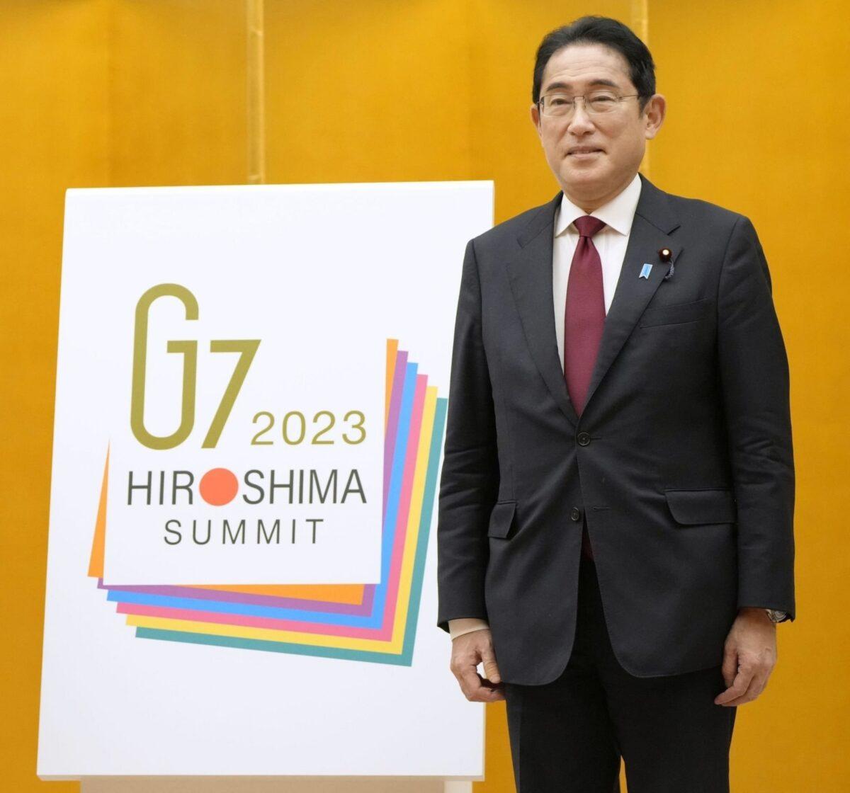 Japanese Prime Minister Fumio Kishida stands with the logo for a summit of the Group of Seven industrialized nations in Hiroshima, Japan, in May 2023.
