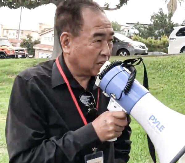 Chen Jun, also known as John Chen, in a confrontation with Chinese dissident activists on Sept. 15, 2019, in a still from video. (Courtesy of Chen Weiming)