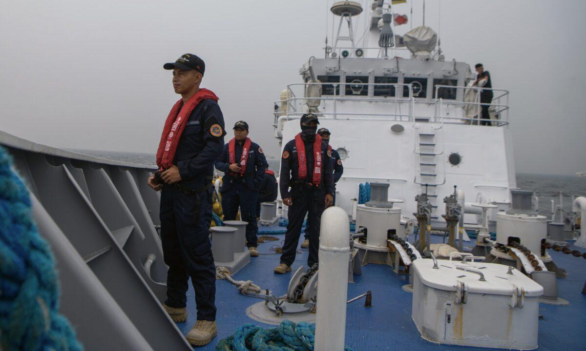 Members of the Philippine Coast Guard take part in a simulation during a trilateral maritime exercise with the Japanese and U.S. coast guards, 15 nautical miles off the coast of Bataan province in the Philippines on June 6, 2023. (Jes Aznar/Getty Images)