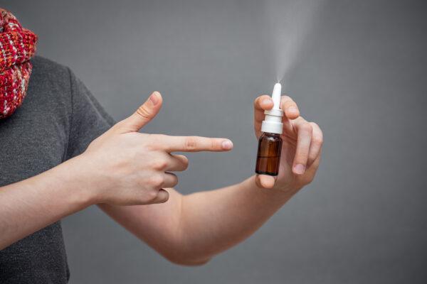 <span class="caption">Don’t just jam it up there. Point nasal spray back and slightly outwards. </span>(Leka Sergeeva/Shutterstock)