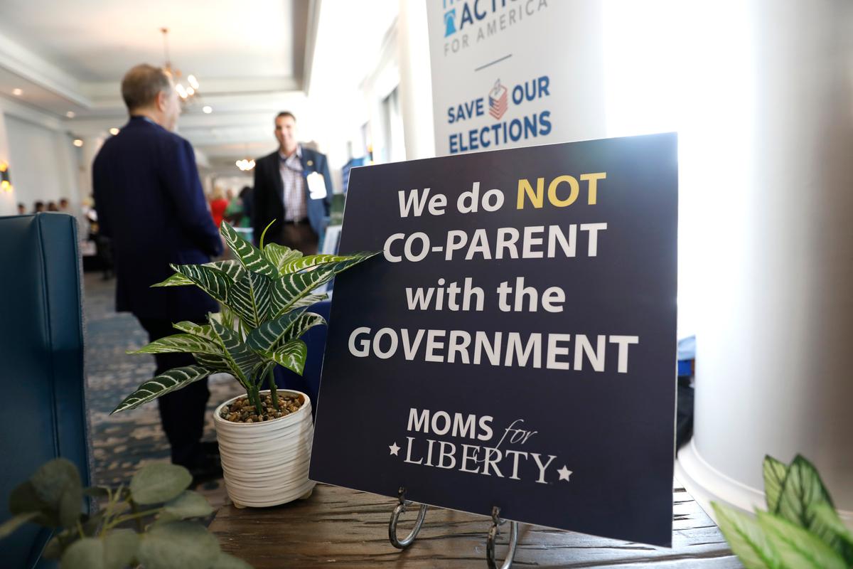 A sign is prominently placed in the hallway during the inaugural Moms for Liberty Summit at the Tampa Marriott Water Street on July 15, 2022 in Tampa, Florida. (Photo by Octavio Jones/Getty Images)