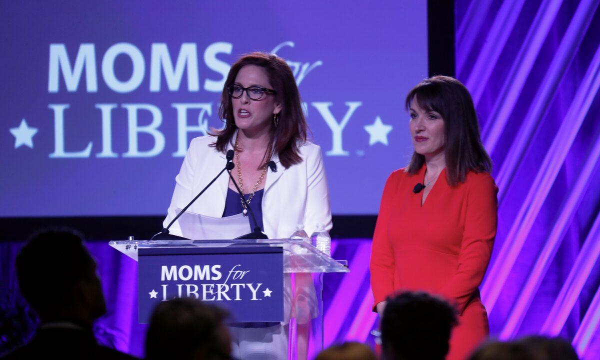 Moms for Liberty founders Tiffany Justice (L) and Tina Descovich (R) give the opening remarks before Florida Gov. Ron DeSantis speaks during the inaugural Moms For Liberty Summit in Tampa, Fla, on July 15, 2022. (Octavio Jones/Getty Images)