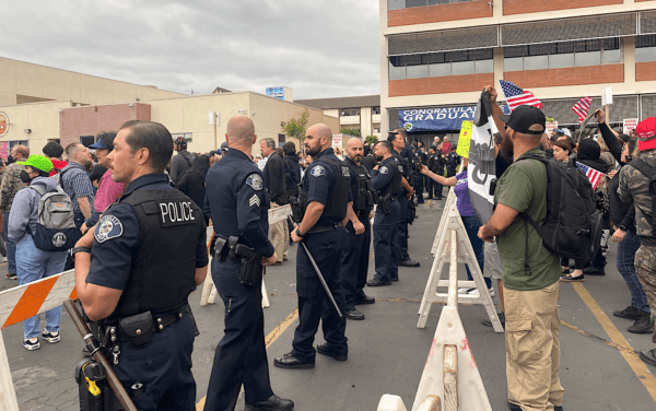 Police separate protesters and counter-protesters outside of Glendale Unified’s board meeting, where the school board voted unanimously to proclaim June 2023 as “LGBT Pride Month,” in Glendale, Calif., on June 6, 2023. (Micaela Ricaforte/The Epoch Times)