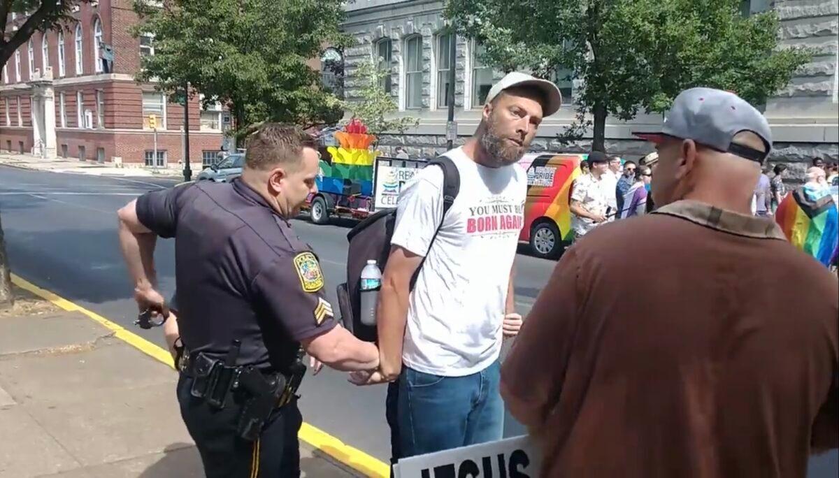 Police arrest street preacher Damon Atkins for speaking briefly at a Pride event in Reading, Pa., on June 3, 2023. (Courtesy of Matthew Wear)