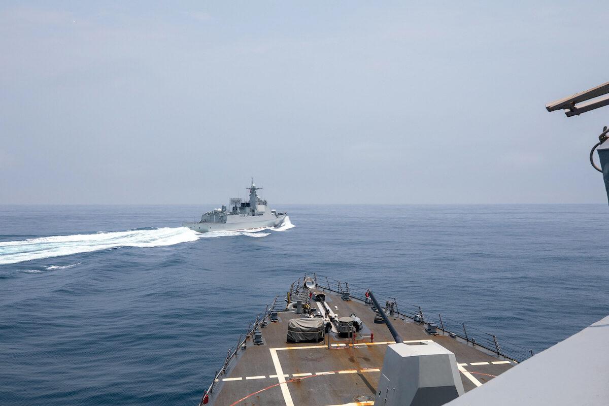 The Arleigh Burke-class guided-missile destroyer USS Chung-Hoon is observing the Chinese PLA Navy vessel Luyang III (top) while on transit through the Taiwan Strait with the Royal Canadian Navy's HMCS Montreal on June 3, 2023. (Andre T. Richard / US NAVY / AFP)