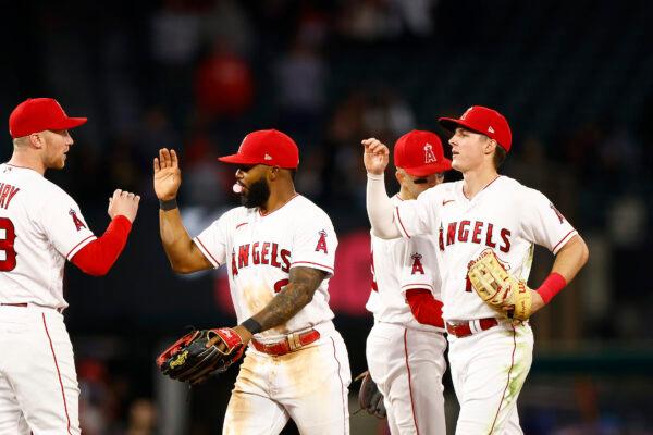 Luis Rengifo (2) of the Los Angeles Angels and Mickey Moniak (16) of the Los Angeles Angels celebrate a 6–2 win against the Chicago Cubs at Angel Stadium of Anaheim in Anaheim, Calif., on June 6, 2023 (Ronald Martinez/Getty Images)