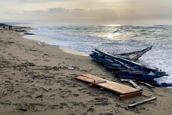 A view of part of the wreckage of a capsized boat that was washed ashore at a beach near Cutro, southern Italy, on Feb. 27, 2023. (Paolo Santalucia/AP Photo)