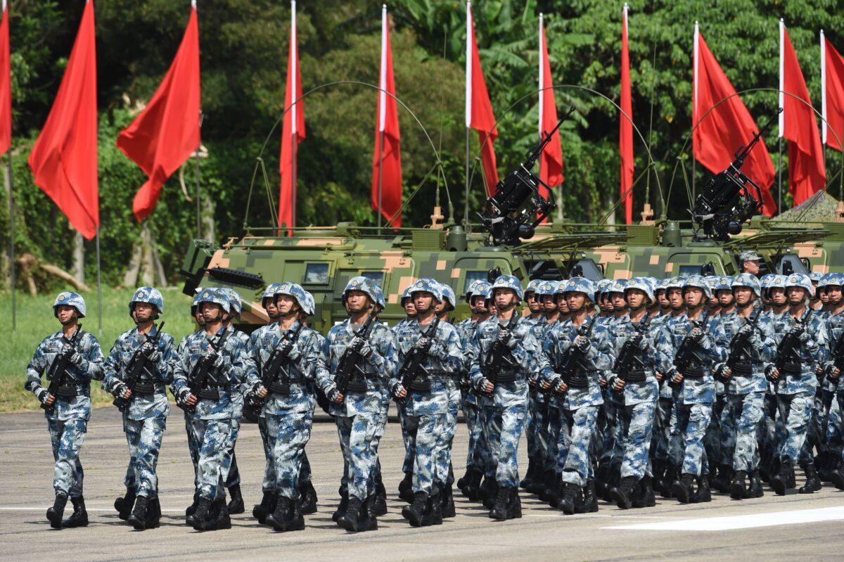 Members of the Chinese People's Liberation Army based at the Hong Kong garrison march following Chinese President Xi Jinping's review in Hong Kong on June 30, 2017. (Anthony Wallace/AFP via Getty Images)