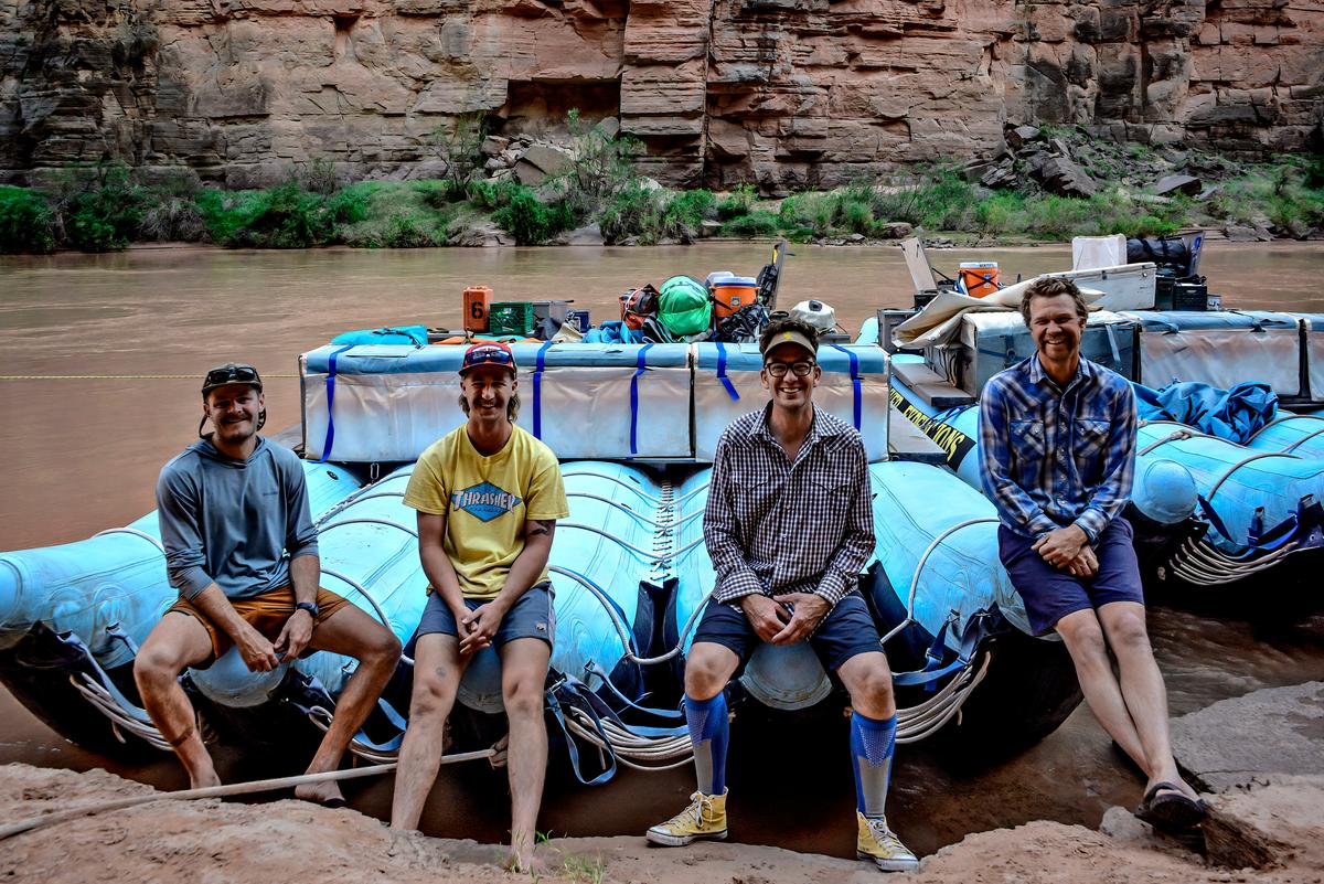 <span style="font-weight: 400;">River guides Bill Frothingham (L), Shelby Wolfe, Ben Bressler, and Joe Clark sit on the pontoons of the 35-foot J-Rigs. </span> (Maria Coulson)