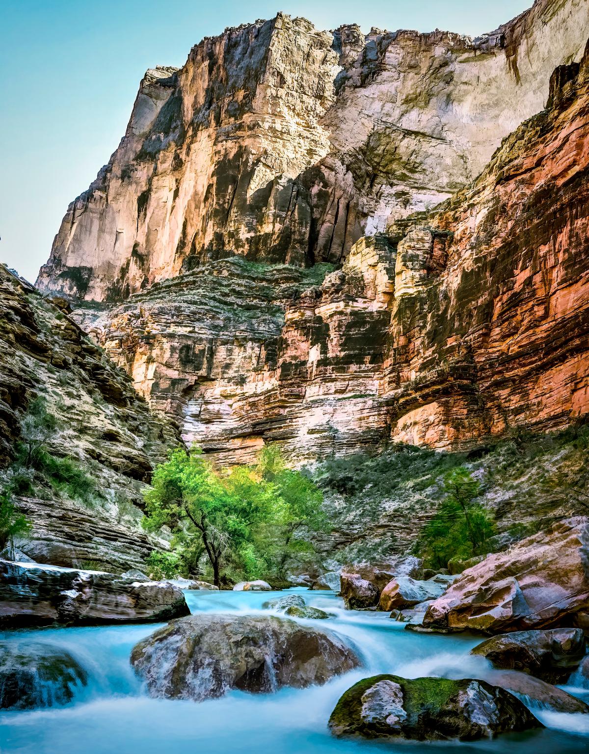 Havasu Creek’s turquoise waters cascade below red canyon walls. (Maria Coulson)