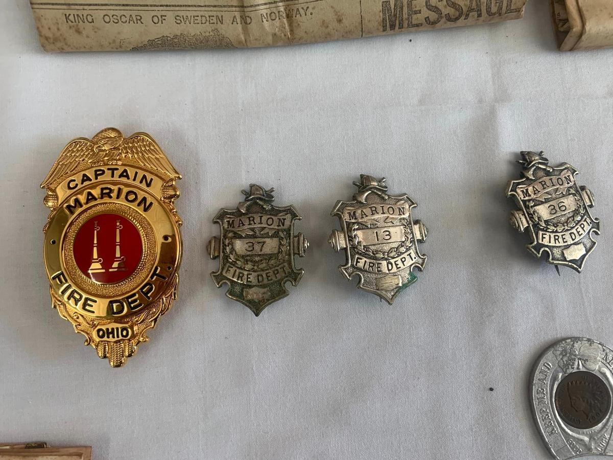 The time capsule contained old fire department badges. (Courtesy of City of Marion Ohio Fire Department)