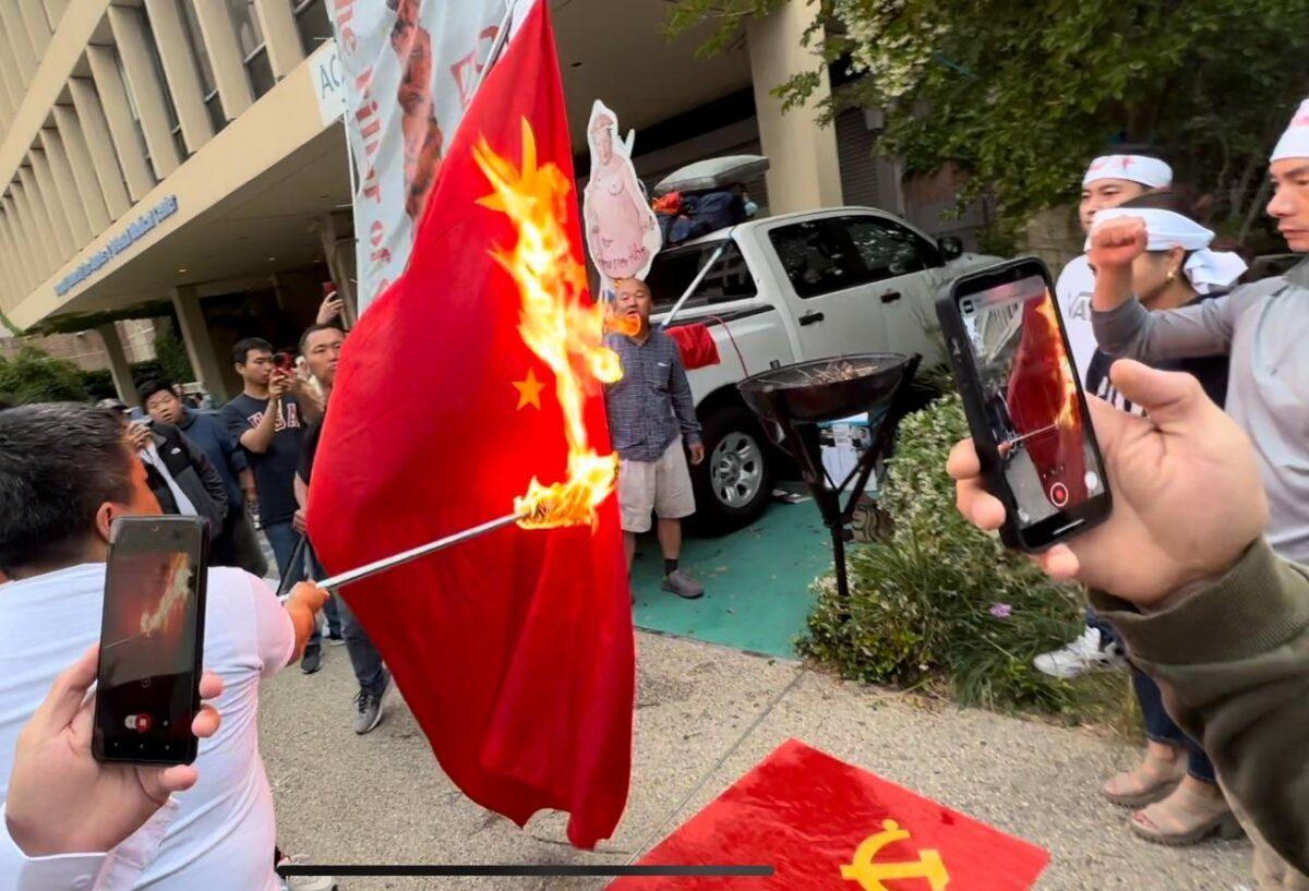 Protesters burn the Chinese Communist Party flag in front of the Chinese Consulate in Los Angeles on the 34th anniversary of the Tiananmen Square Massacre, on June 4, 2023. (Courtesy of Jie Lijian)