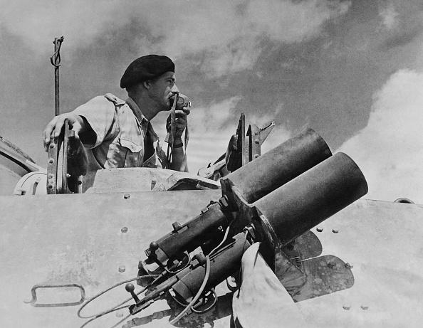 A commander of the Commonwealth and Allied forces gives instructions to tanks, in 1942 on the battlefield at El Alamein in North Africa. (AFP via Getty Images)
