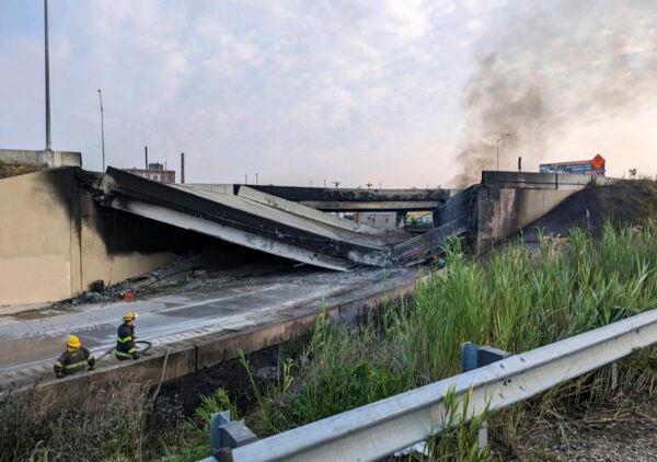Firefighters stand near the collapsed part of I-95 in Philadelphia on June 11, 2023. (Philadelphia Fire Department via AP)