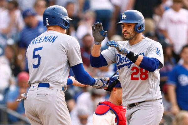 J.D. Martinez (28) of the Los Angeles Dodgers is congratulated by Freddie Freeman (5) after he hit a three-run home run during the seventh inning against the Philadelphia Phillies at Citizens Bank Park in Philadelphia on June 10, 2023. (Rich Schultz/Getty Images)