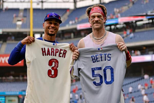 PHILADELPHIA, PENNSYLVANIA - JUNE 11: Mookie Betts #50 of the Los Angeles Dodgers and Bryce Harper #3 of the Philadelphia Phillies exchange signed jerseys after their game at Citizens Bank Park on June 11, 2023 in Philadelphia, Pennsylvania. The Phillies defeated the Dodgers7-3. (Photo by Rich Schultz/Getty Images)