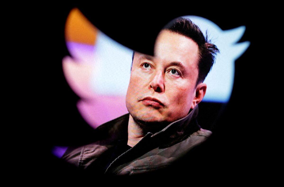 Elon Musk's photo through a Twitter logo on Oct. 28, 2022. (Dado Ruvic/Reuters)