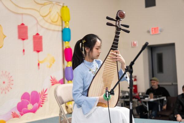 A musician plays the pipa, a Chinese musical instrument, at the Chinese New Year's celebration in Orange County, New York, on Jan. 29, 2023. (Larry Dye/The Epoch Times)