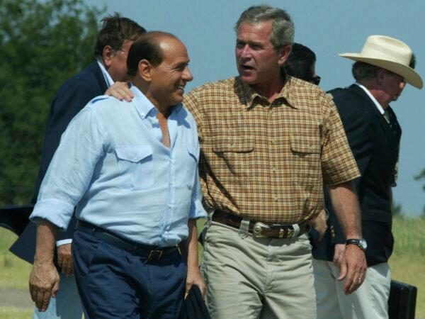 President Bush embraces Italy's Prime Minister Silvio Berlusconi as he welcomes him to his ranch in Crawford, Texas on July 20, 2003. (Charles Dharapak/AP Photo)