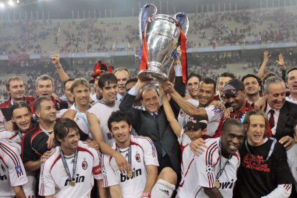 AC Milan's Silvio Berlusconi raises the trophy aloft as he stands with his team after they beat Liverpool 2-1 to win the Champions League Final soccer match between AC Milan and Liverpool at the Olympic Stadium in Athens, on May 23, 2007. (Luca Bruno/AP Photo)