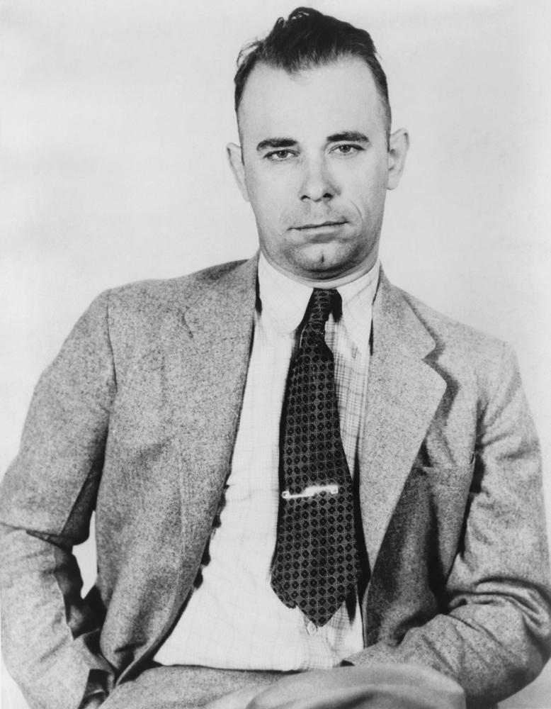 Gangster John Dillinger is said to have hidden a suitcase full of cash in the woods behind the Little Bohemian Lodge in Wisconsin; it has yet to be found. (Everett Collection/Shutterstock)
