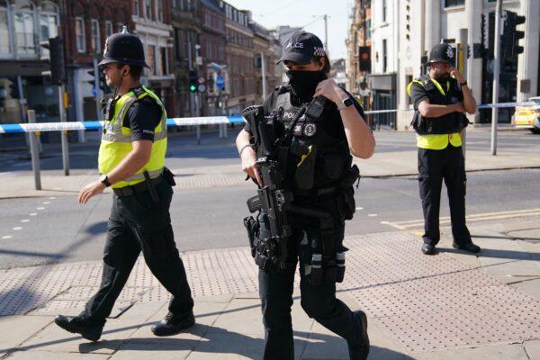 Police officers on guard following deadly attacks in Nottingham city centre, England, on June 13, 2023. (Jacob King/PA Media)