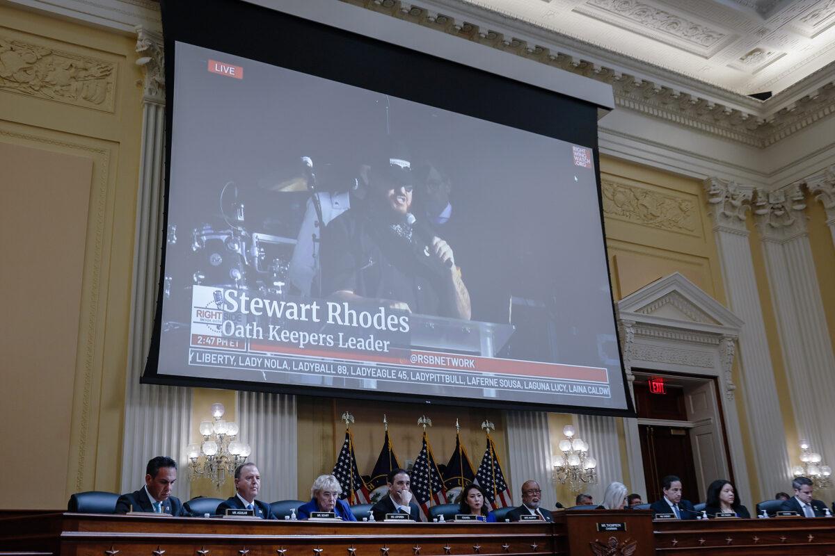 Oath Keepers founder Stewart Rhodes appears on a video screen above members of the Select Committee to Investigate the January 6th Attack on the U.S. Capitol during the seventh hearing on the Jan. 6 investigation on July 12, 2022. (Anna Moneymaker/Getty Images)