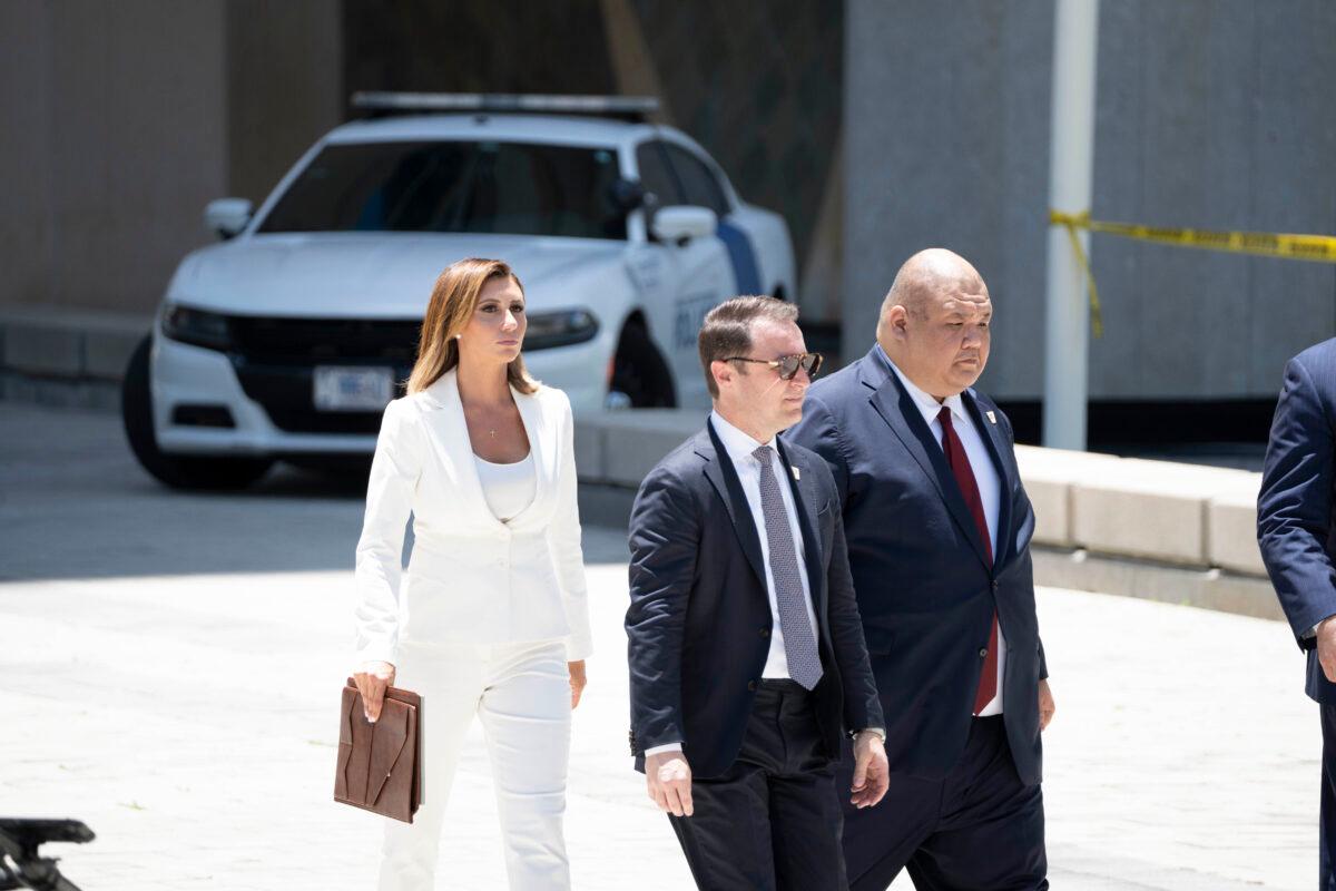 Alina Habba, a spokesperson for former president Donald Trump, walks toward a media scrum outside the federal courthouse in Miami, on June 13, 2023. (Madalina Vasiliu/Epoch Times)