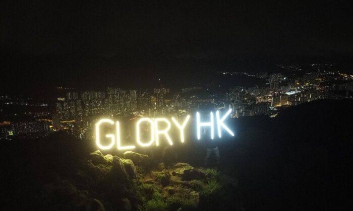 Hongkongers Held Aloft Their Appeal for Freedom and Light on Lion Rock Amidst Darkness