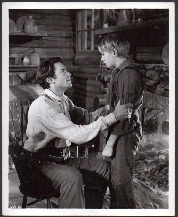 Penny Baxter (Gregory Peck) tries to help his son Jody (Claude Jarman Jr.) grow up well, in "The Yearling." (MovieStillsDB)