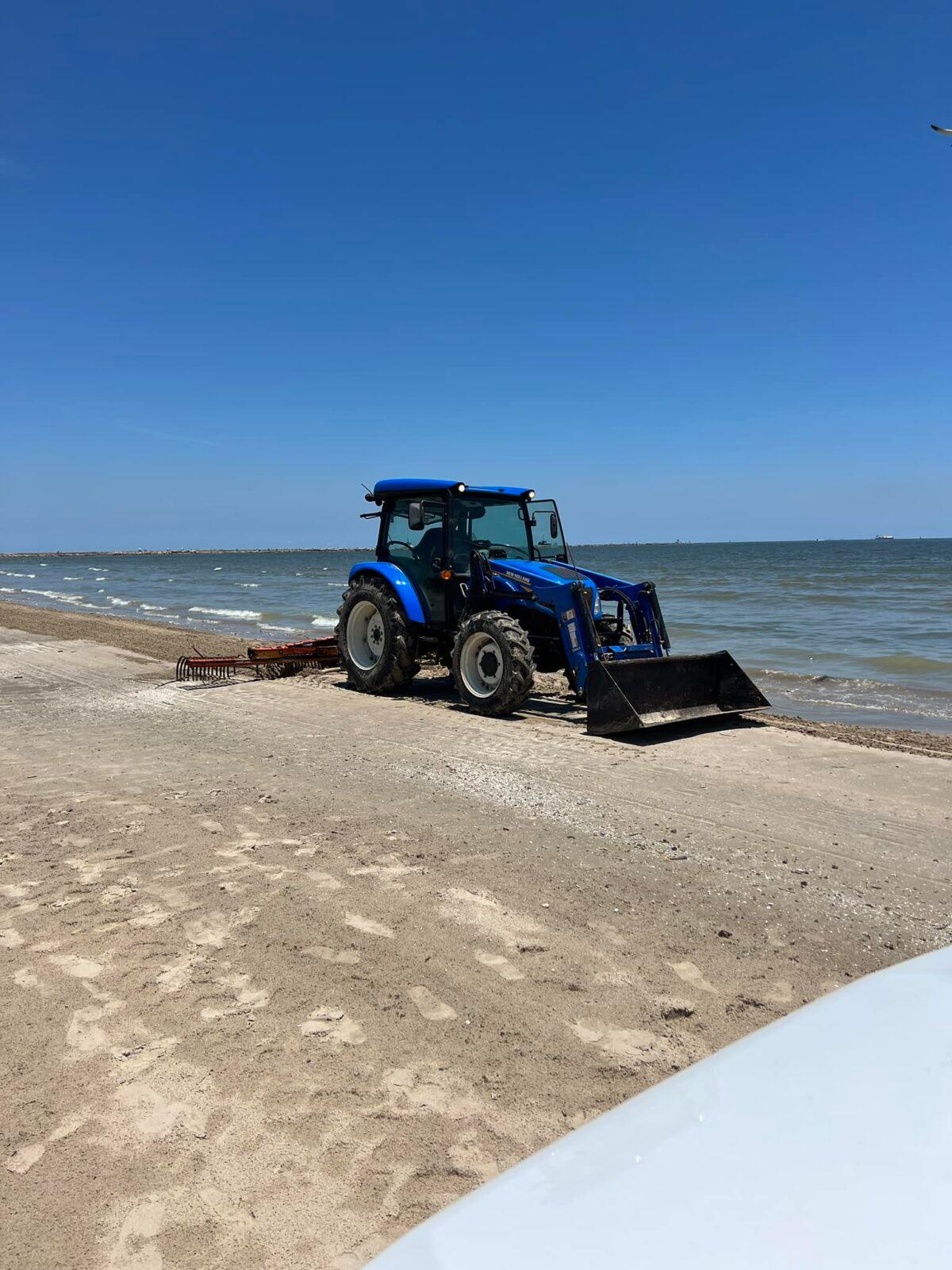 Tractor cleaning up after fish kill on Quintana Beach County Park, Texas, in June 2023. (Courtesy of Quintana Beach County Park's Department)