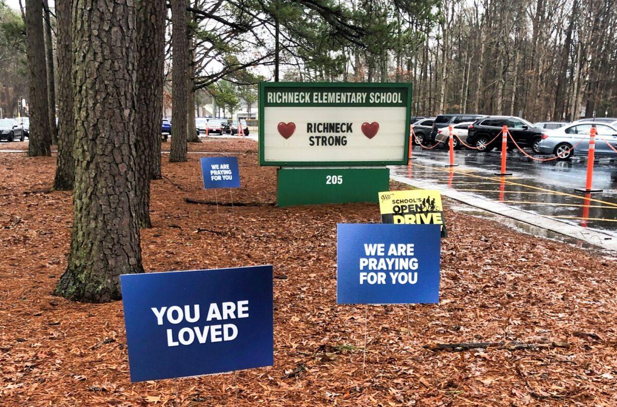 Signs stand outside Richneck Elementary School in Newport News, Va., on Jan. 25, 2023. (Denise Lavoie/AP Photo)