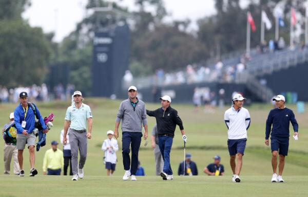 Scottie Scheffler, Paul Haley II, Michael Kim and Collin Morikawa of the and Sam Burns, all of the United States, walk along the fairway during a practice round prior to the 123rd U.S. Open Championship at The Los Angeles Country Club in Los Angeles on June 14, 2023. (Richard Heathcote/Getty Images)