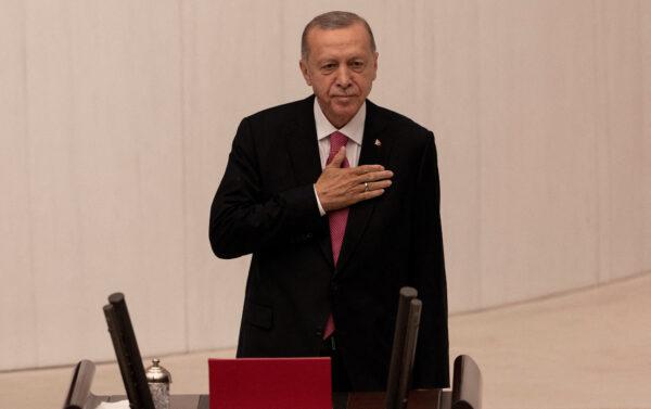 Turkish President Recep Tayyip Erdogan greets members of parliament as he arrives to take the oath of office after his election win in Ankara on June 3, 2023. (Umit Bektas/Reuters)