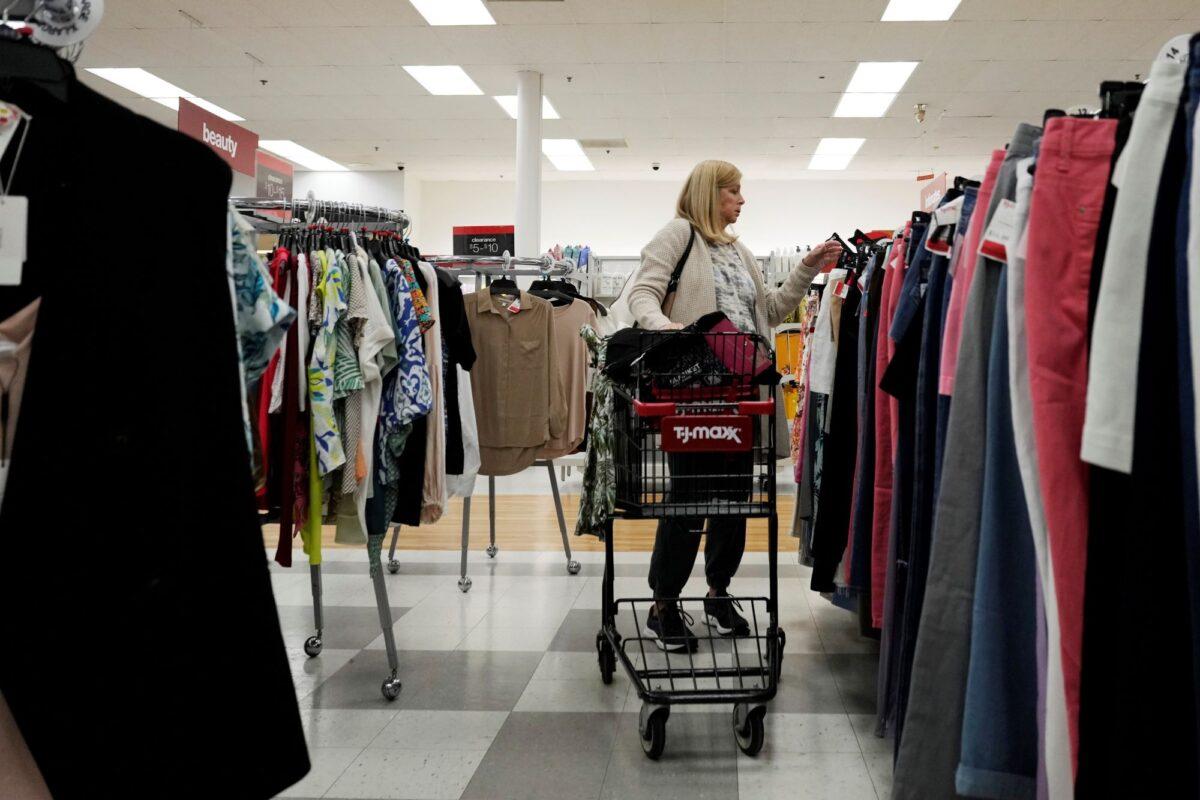  A customer checks prices while shopping at a retail store in Vernon Hills, Ill., on June 12, 2023. (Nam Y. Huh/AP Photo)