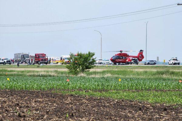 First responders at the scene of a road accident that left 15 dead near Carberry, west of Winnipeg, on June 15, 2023. (Nirmesh Vadera/AFP via Getty Images)
