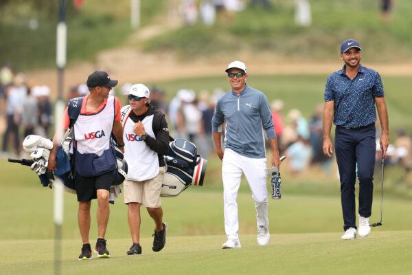 Rickie Fowler of the United States and Jason Day of Australia walk up the seventh hole during the first round of the 123rd U.S. Open Championship at The Los Angeles Country Club in Los Angeles on June 15, 2023. (Ezra Shaw/Getty Images)