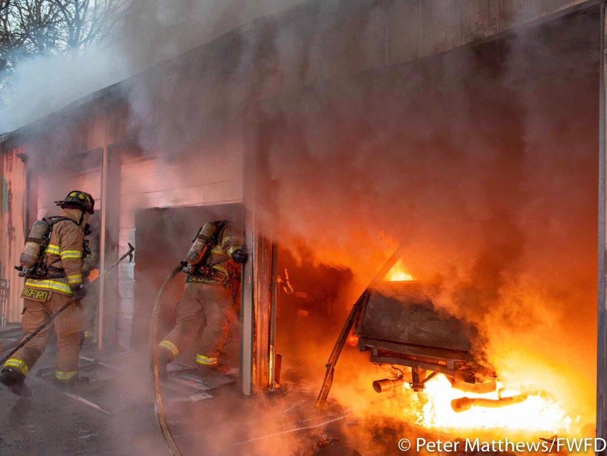 Fort Worth firefighters battle a large detached shop fire with multiple vehicles and equipment in Fort Worth, Texas. (Peter Matthews/FWFD)