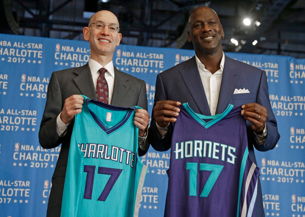 NBA commissioner Adam Silver (left) and Charlotte Hornets owner Michael Jordan pose for a photo during a news conference to announce Charlotte, N.C., as the site of the 2017 NBA All-Star basketball game, on June 23, 2015. (Chuck Burton/AP Photo)