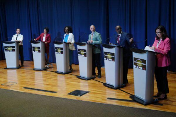 Toronto mayoral candidates at a previous debate. (L–R) Josh Matlow, Olivia Chow, Mitzie Hunter, Brad Bradford, Mark Saunders, and Ana Bailao take the stage at a mayoral debate in Scarborough, Ont., on May 24, 2023. (Chris Young/The Canadian Press)
