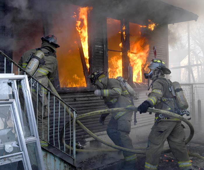 Fort Worth firefighters making an entry into a single-story residential structure fire in Fort Worth, Texas. (Glen Ellman/Fort Worth FD)