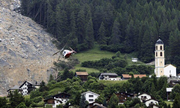 Mass of Rock Slides Down Swiss Mountainside Above Evacuated Village, Narrowly Missing Settlement