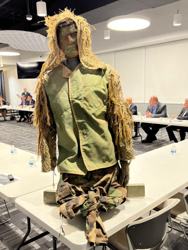 A "ghillie suit" camouflage worn by Chilean burglars to blend into the landscape is on display at a roundtable regarding a sharp rise in organized crime including home burglaries and robberies in the United States that are linked to Chilean nationals, in Santa Ana, Calif., on June 16, 2023. (Brad Jones/The Epoch Times)