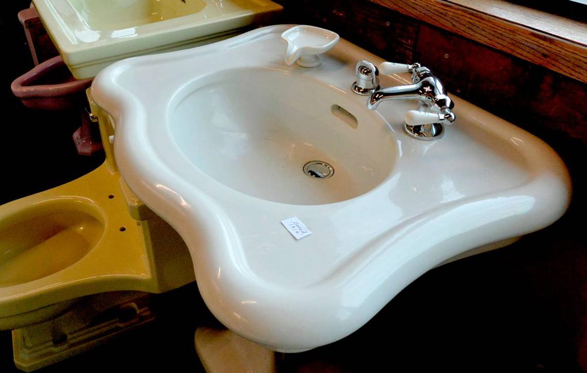 Bill Graham rebuilt this pedestal sink and antique soap dish, manufactured by Crane Company in 1914. (Monty Davis/The Kansas City Star/TNS)