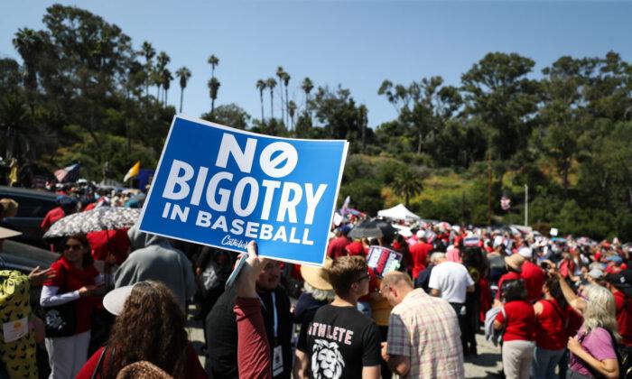 Protesters hold signs at a Catholics for Catholics event in response to the Dodgers' Pride Night event including the Sisters of Perpetual Indulgence on June 16, 2023. (Meg Oliphant/Getty Images)