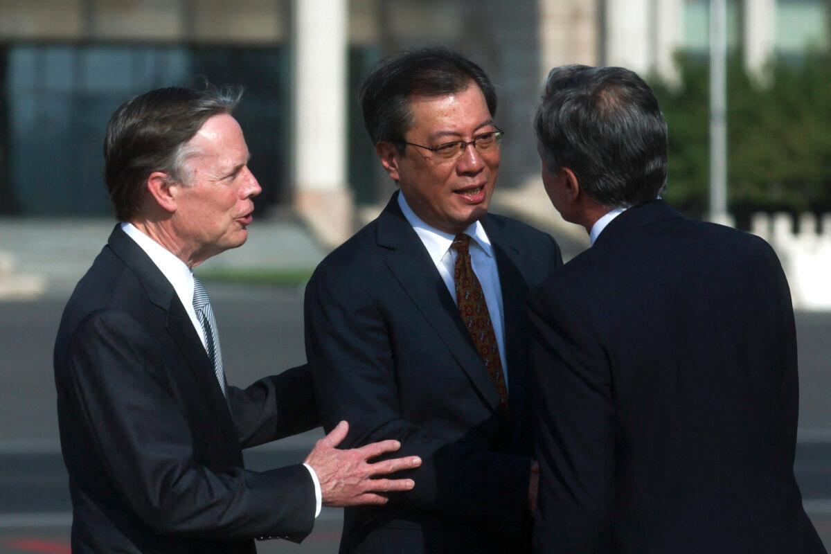 U.S. Secretary of State Antony Blinken (R) is welcomed by Director General of the Department of North American and Oceanian Affairs of the Foreign Ministry Yang Tao and U.S. Ambassador to China Nicholas Burns (L) as he arrives in Beijing on June 18, 2023. (Leah Millis/Pool/AFP via Getty Images)